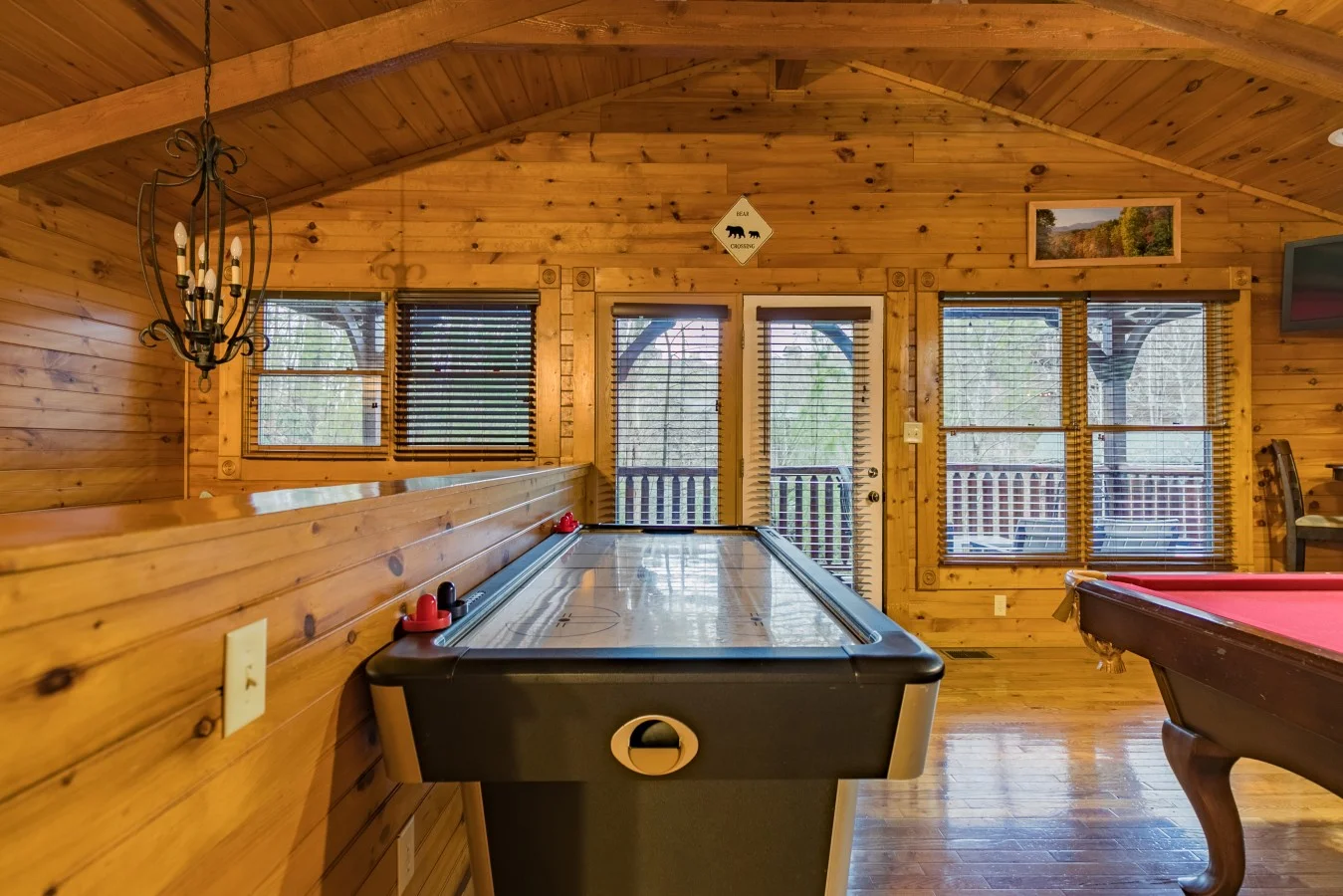 Smoky Mountain Escape game room with air hockey and pool table for a rainy Gatlinburg weekend getaway