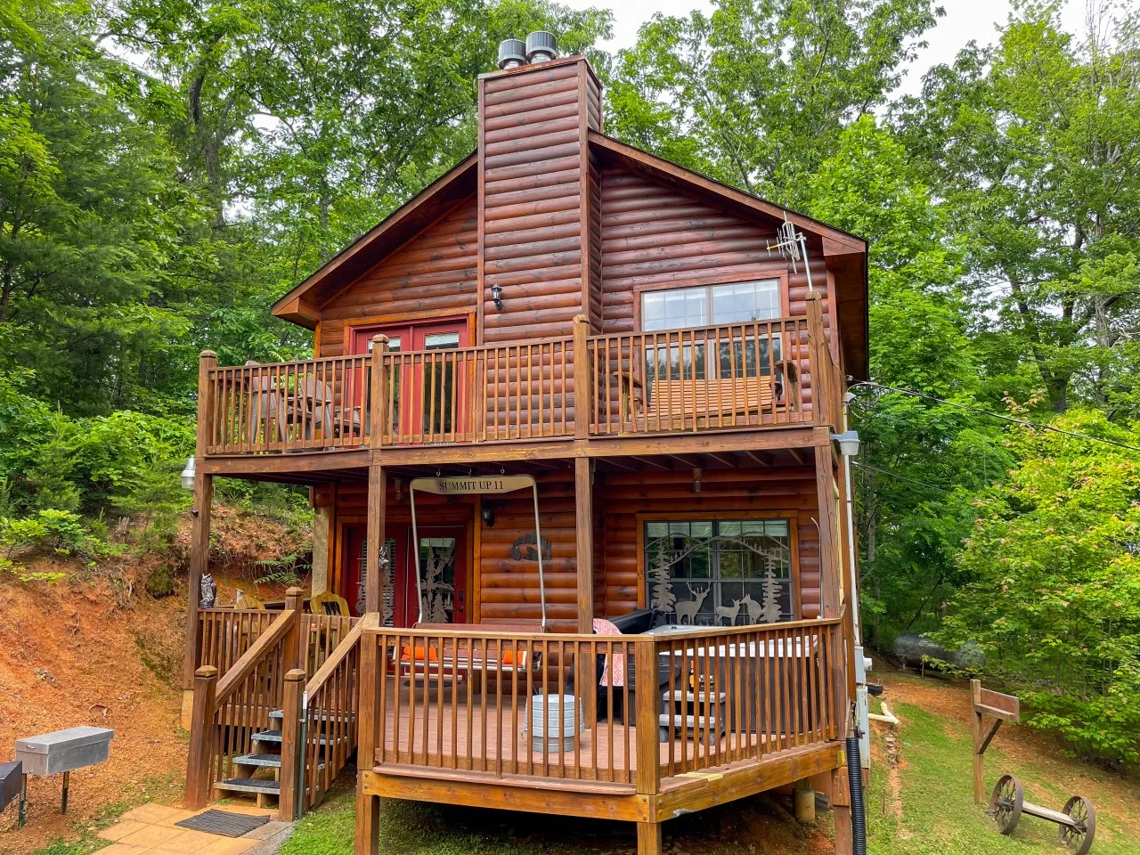 Log cabin exterior at Summit Up, one of the top Sevierville TN vacation rentals with private hot tub