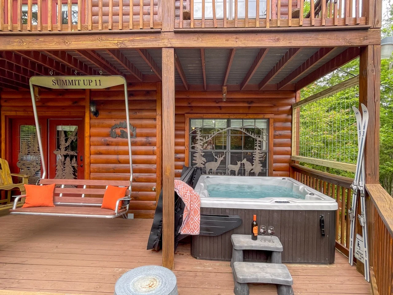 Hot tub and porch swing at a Sevierville cabin near Pigeon Forge, TN cabin rentals