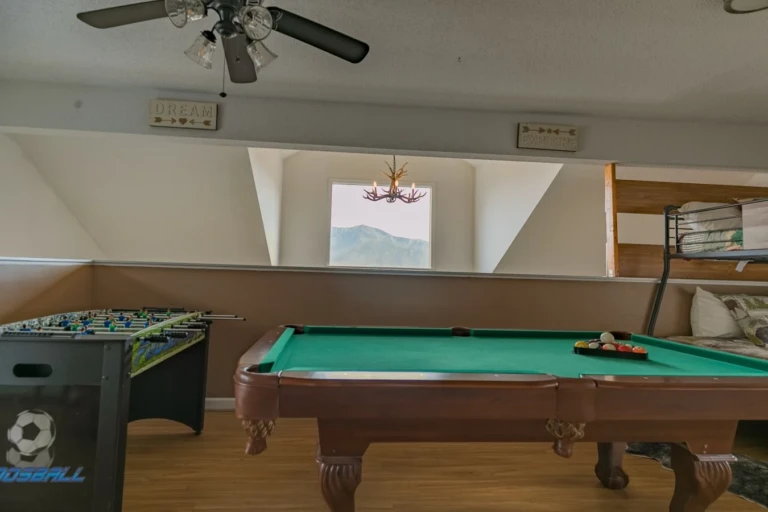 Game room with pool table and mountain view in Gatlinburg cabin with game room amenities
