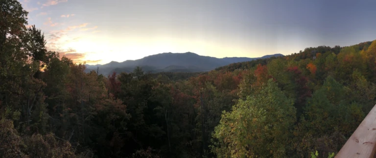 Panoramic sunset view of rolling mountains with autumn foliage from scenic Gatlinburg overlook