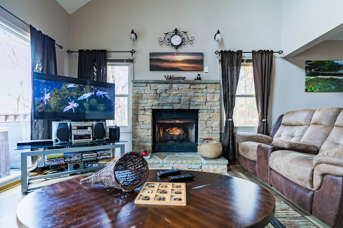 Cabin living room with stone fireplace after a night of Gatlinburg nightlife