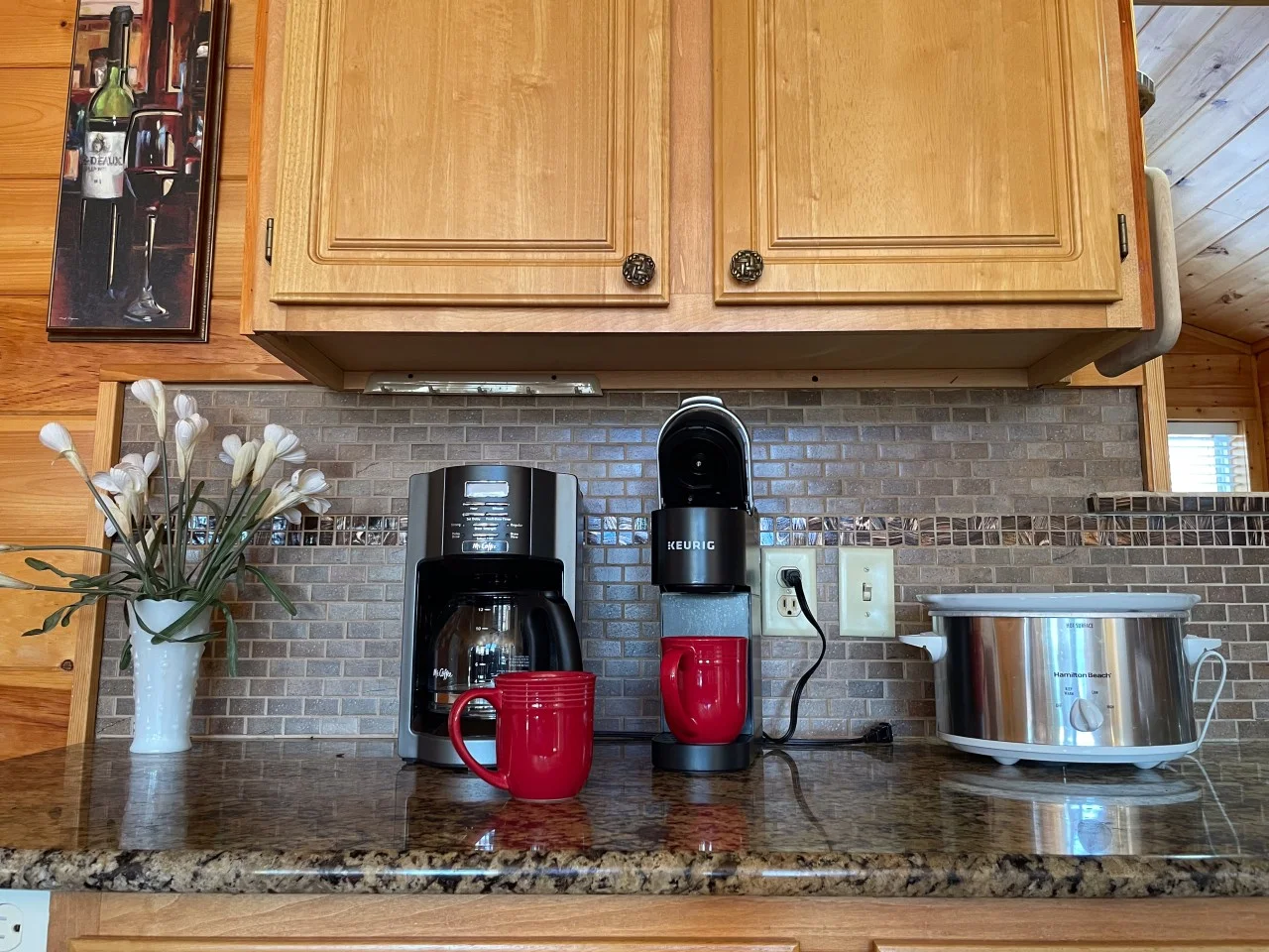 Granite kitchen with Keurig and coffee maker in a Pigeon Forge cabin for a family reunion